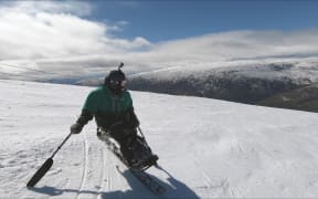 Bailley Unahi, who is paralysed from the waist down says the sport of sit0skiing is physically demanding.