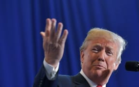 US President Donald Trump gestures as he speaks about combating the opioid crisis.