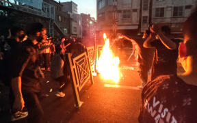 Dozens of people stage a demonstration in Teheran to protest the death of a 22-year-old woman under custody in Tehran Iran on September 21, 2022.