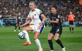 Norway's Frida Maanum and Malia Steinmetz of New Zealand. New Zealand Football Ferns v Norway, Group Stage-Group A match of the 2023 FIFA Women’s World Cup at Eden Park, Auckland, New Zealand on Thursday 20 July 2023. Mandatory credit: Brett Phibbs / www.photosport.nz