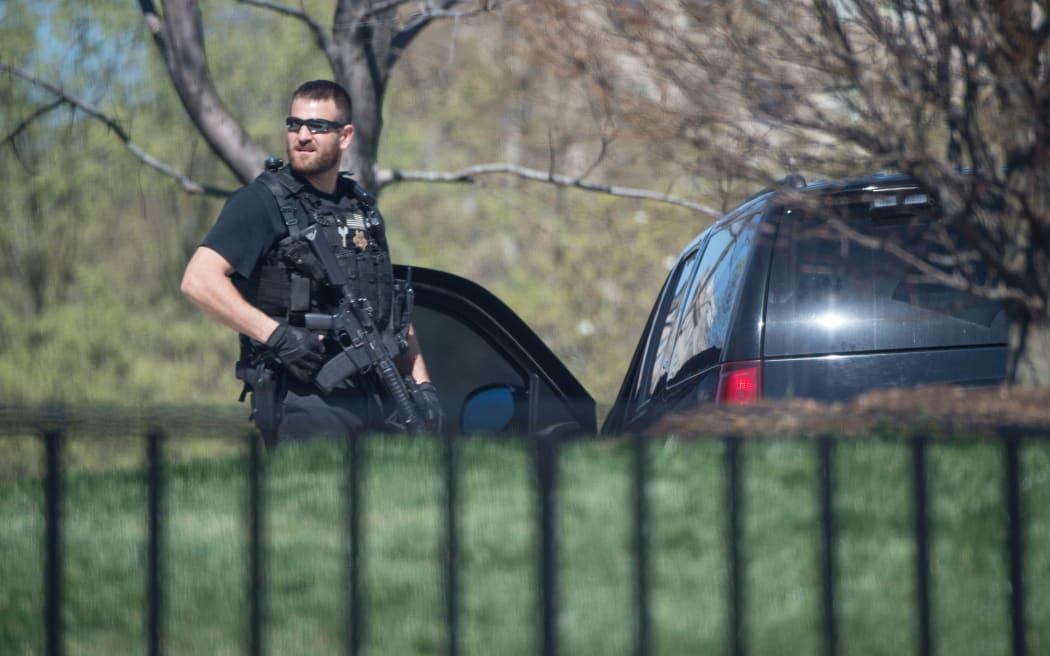 A US Secret Service agent stands guard at the White House after it was put into lockdown