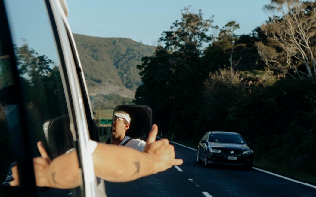 Two cars passing each other on NZ roads