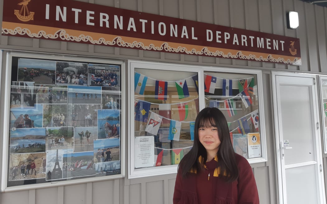 International student Akira Myojo, from Japan, in front of the International Department at Cashmere College