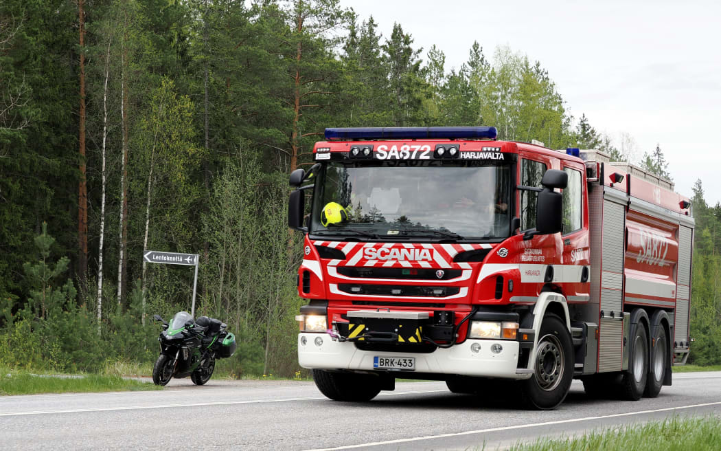 A fire department vehicle arrives at the crash site near the Eura Airfield in Eura, Finland, on May 17, 2025 where two civilian helicopters crashed in Eura according to the Satakunta rescue department. Several people died on May 17, 2025 when two helicopters carrying a total of five collided mid-air in Finland and crashed to the ground, police said.
"The accident has resulted in several fatalities. The exact number of victims and the identities of the passengers are still being determined," the police said in a statement. (Photo by Petri Hakosalo / various sources / AFP) / Finland OUT / FINLAND OUT / FINLAND OUT