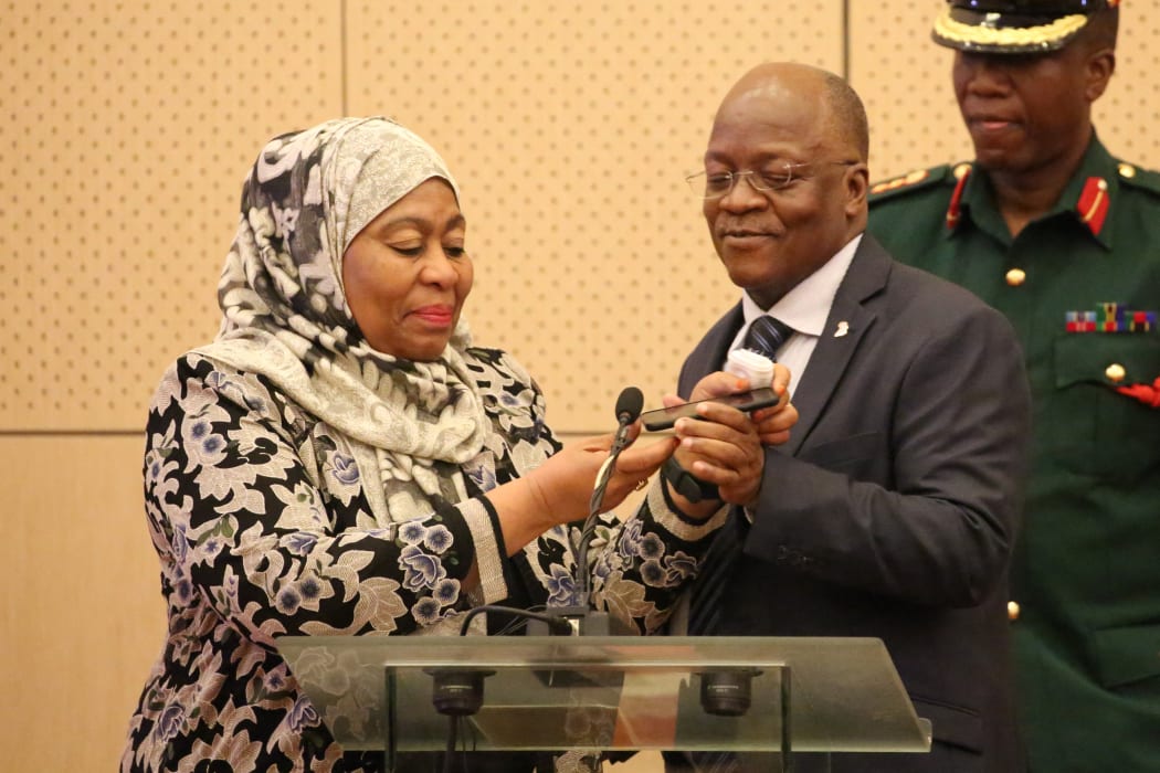 In this file photo taken on July 24, 2019 Tanzania's Vice President Samia Hassan Suluhu (L) and Tanzania's former President John Magufuli.