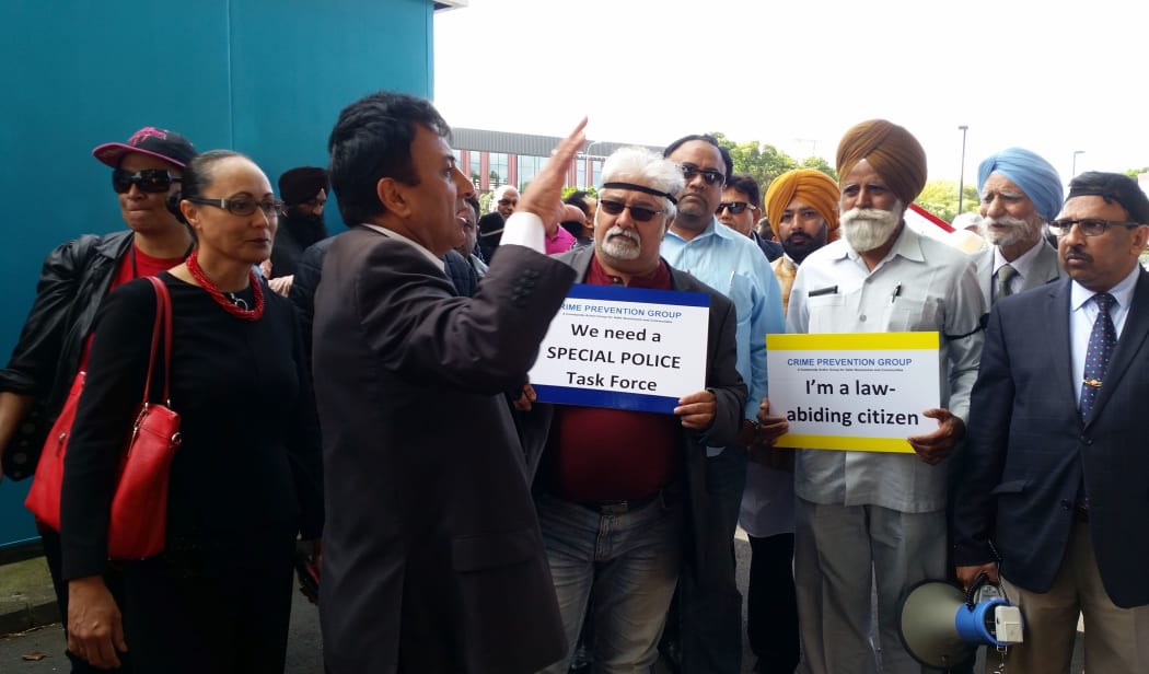 Rally organiser Sunny Kaushal and Labour MP Jenny Salesa speak to protesters.