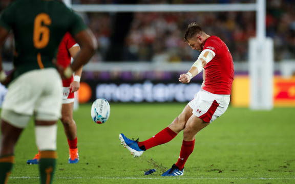 Wales'  first half Dan Biggar (R) scores a penalty kick during the Japan 2019 Rugby World Cup semi-final match between Wales and South Africa.