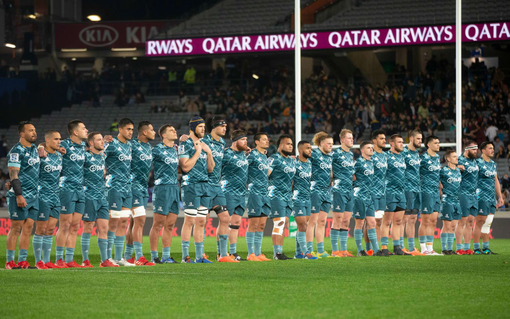 Highlanders line up for a moments silence for Police officer Matthew Hunt before the Super Rugby Aotearoa match, between the Blues and Highlanders held at Eden Park, 2020.