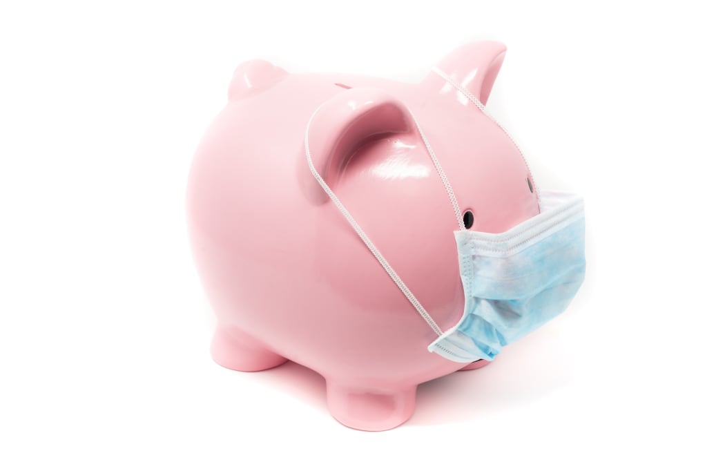 Piggybank wearing surgery mask, concept of the impact on world Economy in a pandemic