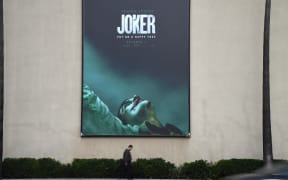 A poster for the upcoming film "The Joker" is seen outside Warner Brothers Studios in Burbank, California, September 27, 2019.