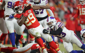 Kareem Hunt of the Kansas City Chiefs runs the ball against the Buffalo Bills during AFC Championship match in Kansas City, Missouri.