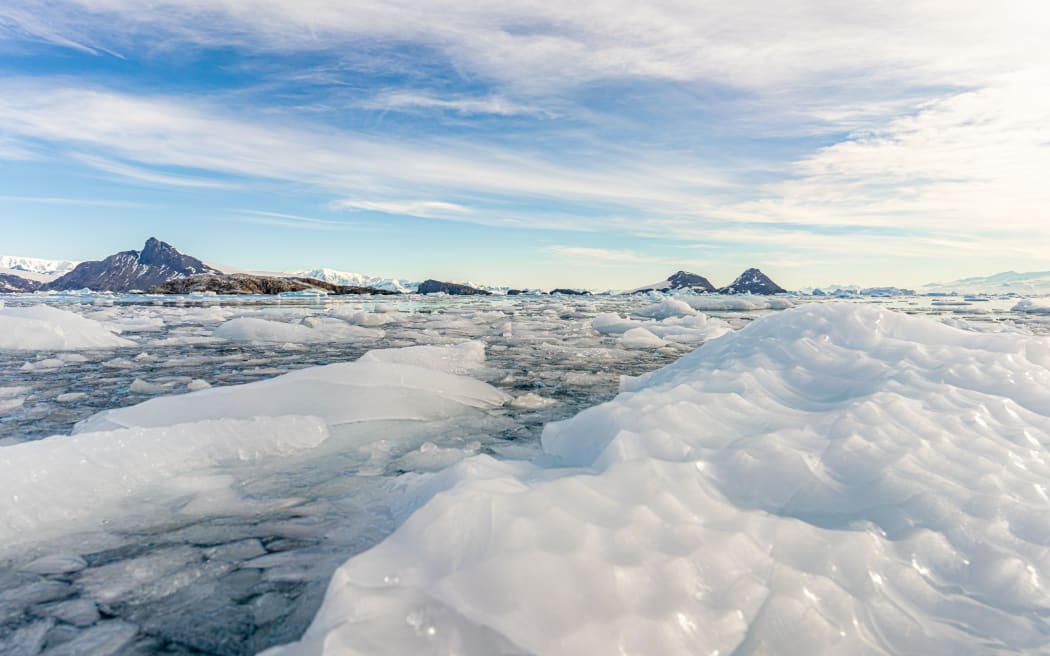 Antarctic iceberg landscape in Cierva Cove - a deep inlet on the west side of the Antarctic Peninsula, surrounded by rugged mountains and dramatic glacier fronts.