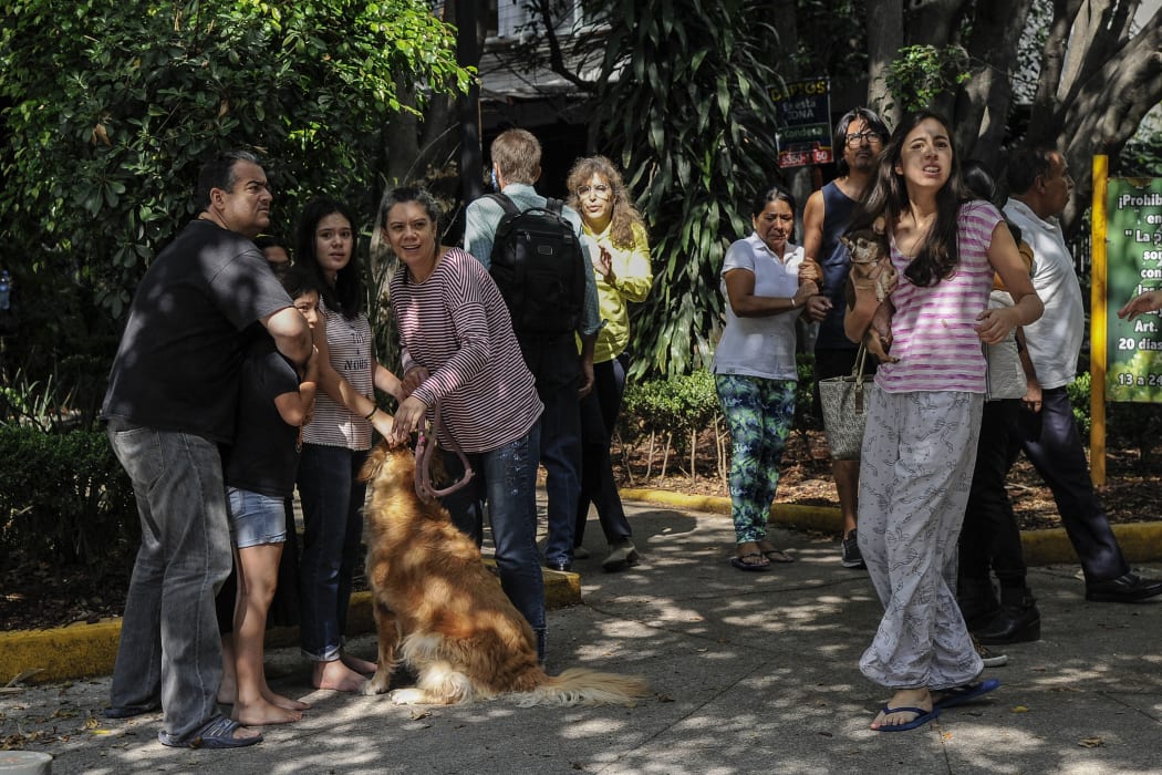 People on the streets in Mexico City following a powerful quake centred on the south coast on 23 June 2020.