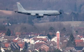 01 March 2022, Rhineland-Palatinate, Landstuhl: A U.S. military aircraft, a KC-135 aerial refueling plane, lands at the U.S. airbase in Ramstein. After the start of the war in Ukraine, aircraft movements here have increased significantly. Photo: Boris Roessler/dpa (Photo by BORIS ROESSLER / dpa Picture-Alliance via AFP)
