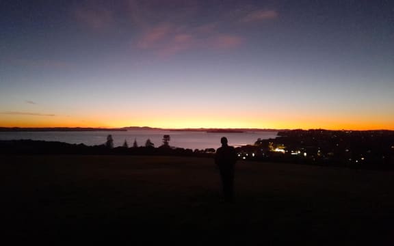 Steam from the umu at Takaparawhau have risen upward towards the stars, as Kai is lifted from the ground.