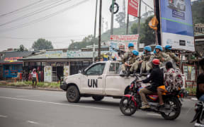 Uruguayan soldiers of the United Nations Organization Stabilization Mission in the Democratic Republic of the Congo (MONUSCO) travel on their pick up truks in Goma, on January 25, 2025. Three South African soldiers were killed and 18 injured in clashes with M23 forces in the east of the Democratic Republic of Congo, where they were part of a southern African mission, a political party and a military union said Saturday. (Photo by Jospin Mwisha / AFP)