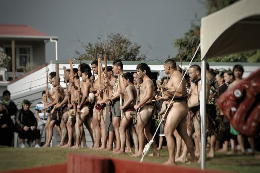 A kapa haka group performs as part of a pōwhiri at Maungapōhatu.