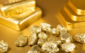 A collection of gold bars, ingots and nuggets (file)