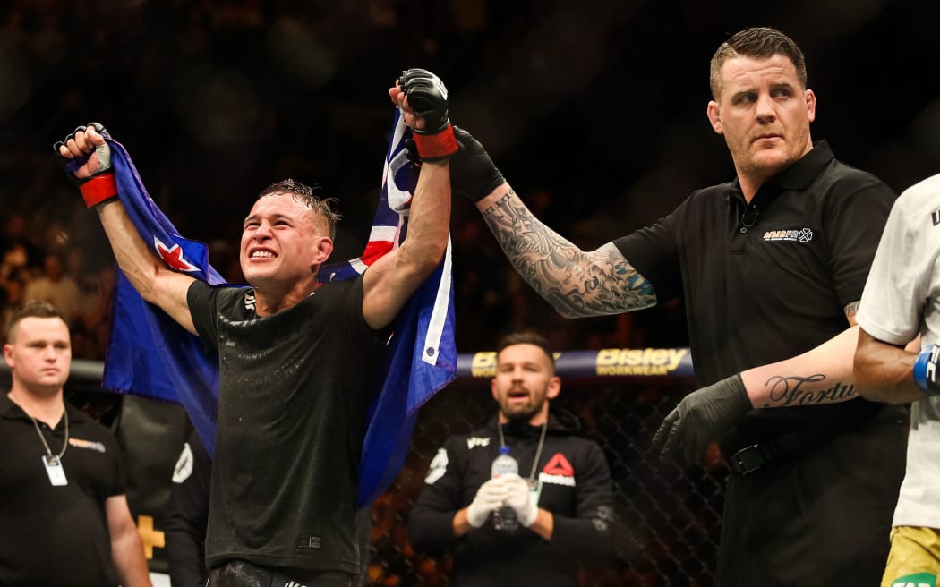 Kai Kara France in black shorts in action against Raulian Paiva in yellow shorts during UFC 234 at Rod Laver Arena Melbourne Australia. Sunday 10th February 2019. Copyright Photo. Brendon Ratnayake / www.photosport.nz