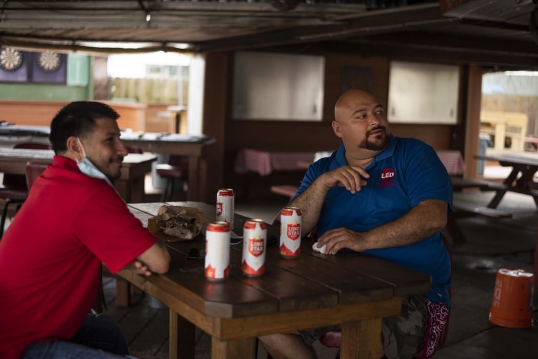 Patrons at the West Alabama Ice House have beers before Texas Governor Greg Abbotts order that all bars are to be closed at noon today in Houston, Texas on June 26, 2020.