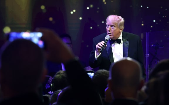US President Donald Trump speaks to guests during a New Year’s Eve event at his Mar-a-Lago home in Palm Beach, Florida, on December 31, 2025.
Mandatory Credit:	Joe Raedle/Getty Images via CNN Newsource
