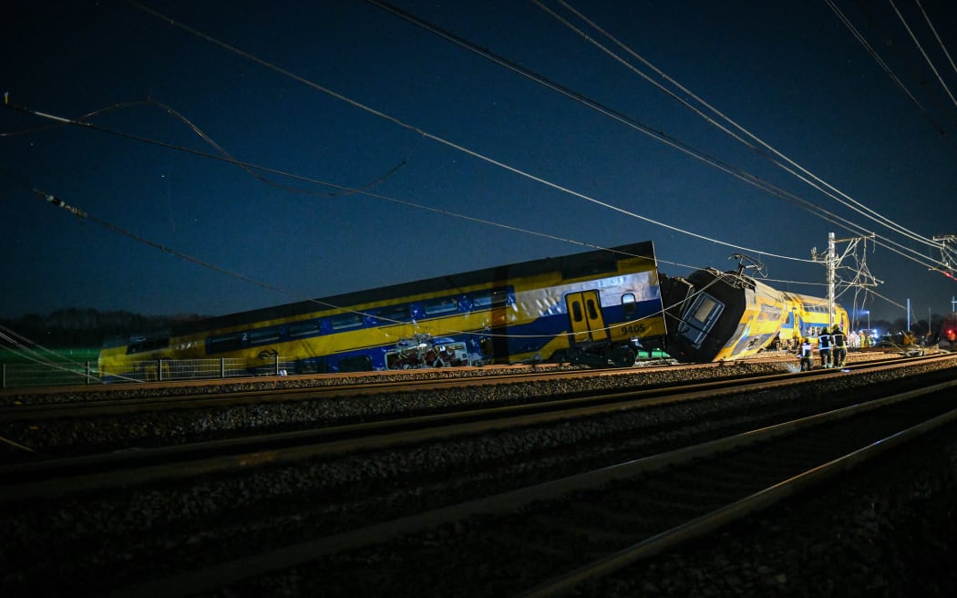 Voorschoten - A derailed train. Several people were seriously injured in a collision between a passenger train and a freight train. ANP JOSH WALET netherlands out - belgium out (Photo by Josh Walet / ANP MAG / ANP via AFP)