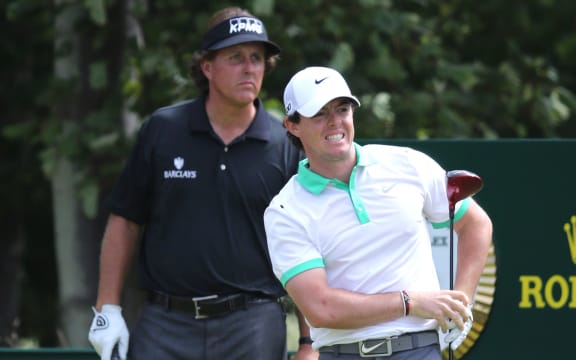 Rory McIlroy and Phil Mickelson on 9th hole during the first round of the 142nd British Open Championship. 2013.