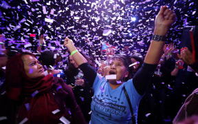 Mazeda Uddin and Marta Cualotuna celebratre the victory of Alexandria Ocasio-Cortez.