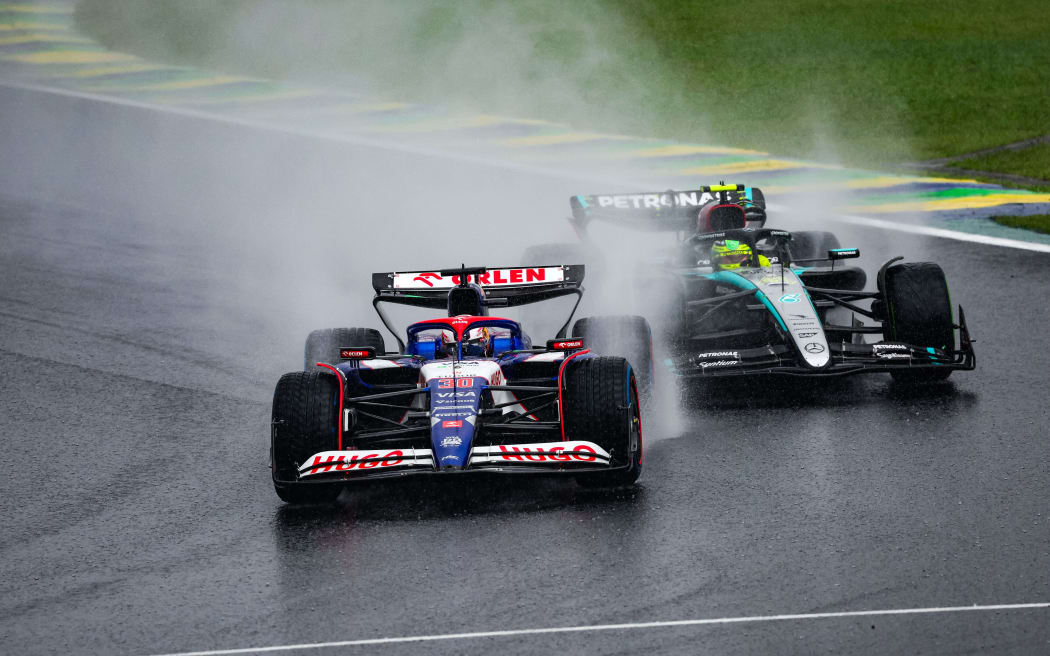 Liam Lawson and Lewis Hamilton during the 2024 Brazil Grand Prix.