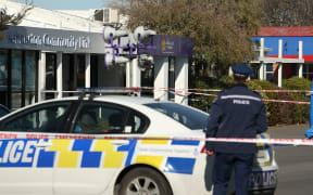 A police officer guards the cordon in central Ashburton.