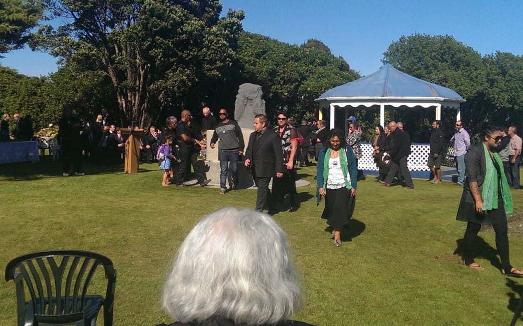 Ngaruahine people gathering in front of memorial stone at Seaview in Hokitika.