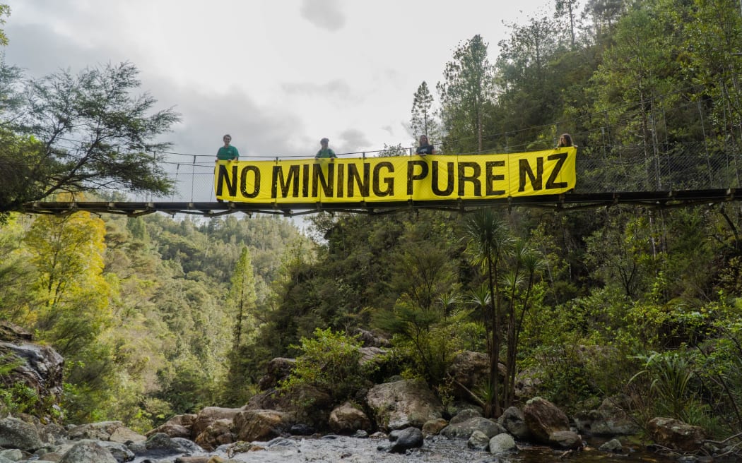Forest & Bird and Forest & Bird Youth hung this banner off a bridge in Wharekirauponga, Coromandel Forest Park on 21 October to protest mining on conservation land.