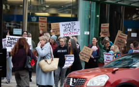 Midwives protest outside the High Court in Wellington.