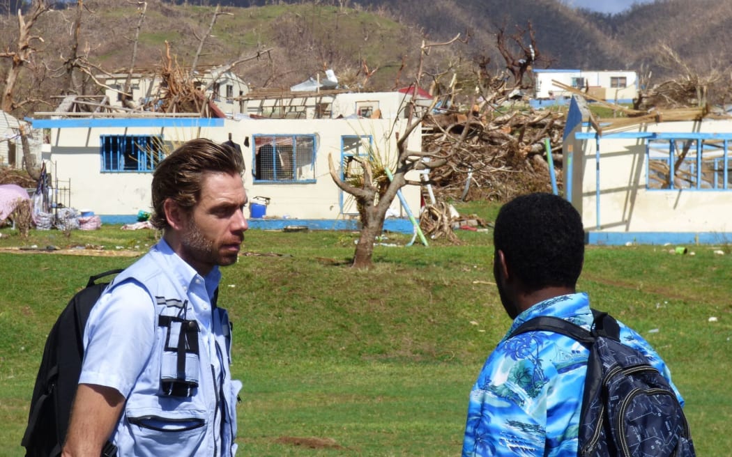 The UN's Sune Gudnitz (L) touring devastated areas of Fiji after Cyclone Winston