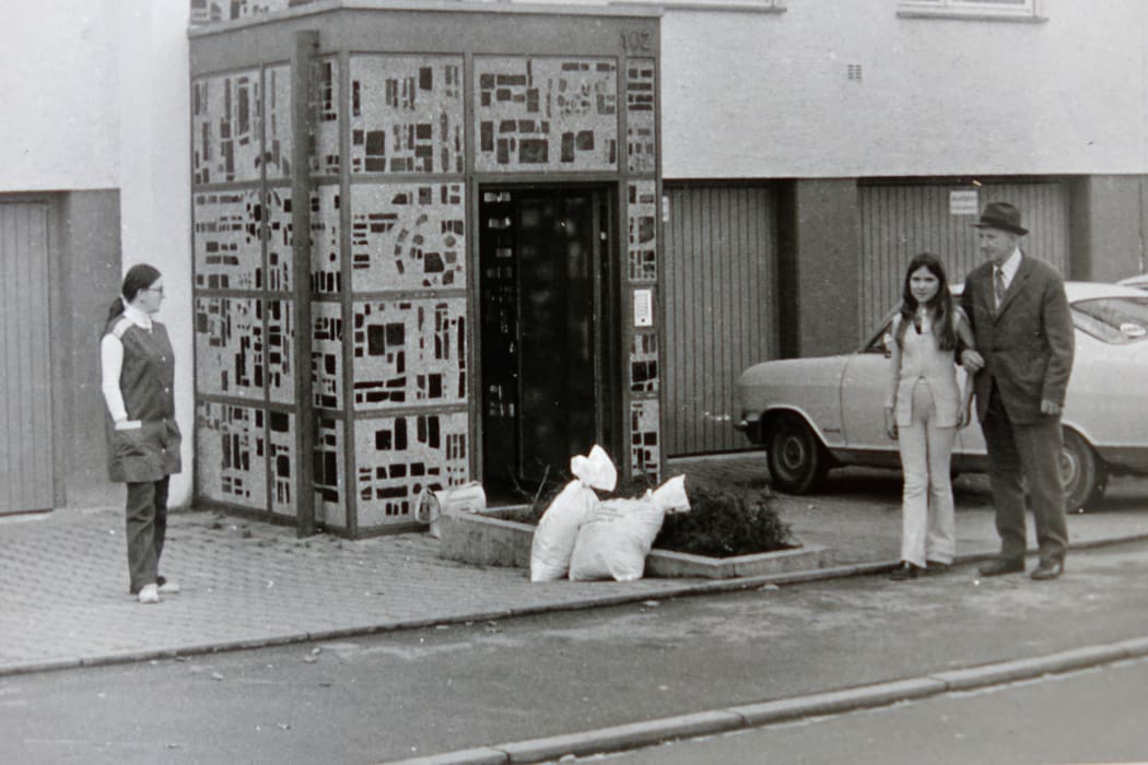Outside the block of flats where we spent our first year - my mum on left, me on right.
