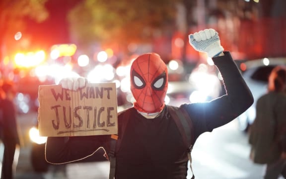 Protestor in a spiderman mask rally against the death of Minneapolis, Minnesota man George Floyd at the hands of polic.