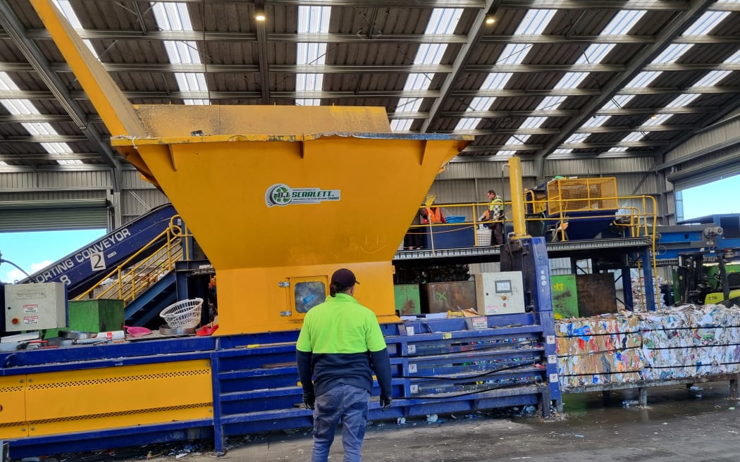 A staff member working the bailer machine at the Te Awamutu recycling facility, in August 2024.