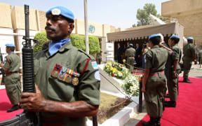 Members of the Fiji Islands UN peackeeping troops perform a guard honour at a memorial monument in the UN headquarters in Baghdad’s Green Zone on August 13, 2008.