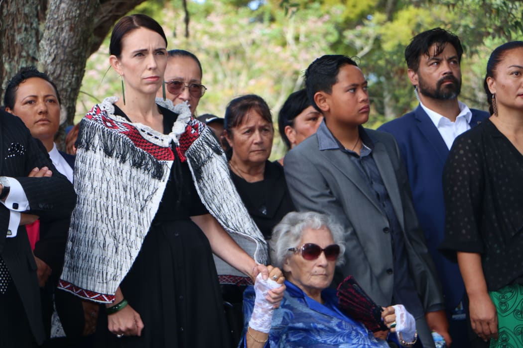 Prime Minister Jacinda Ardern holding hands with Titewhai Harawira as they are welcomed on to the Waitangi Treaty grounds.