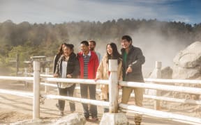Visitors at Te Puia explore Whakarewarewa Geothermal Valley.