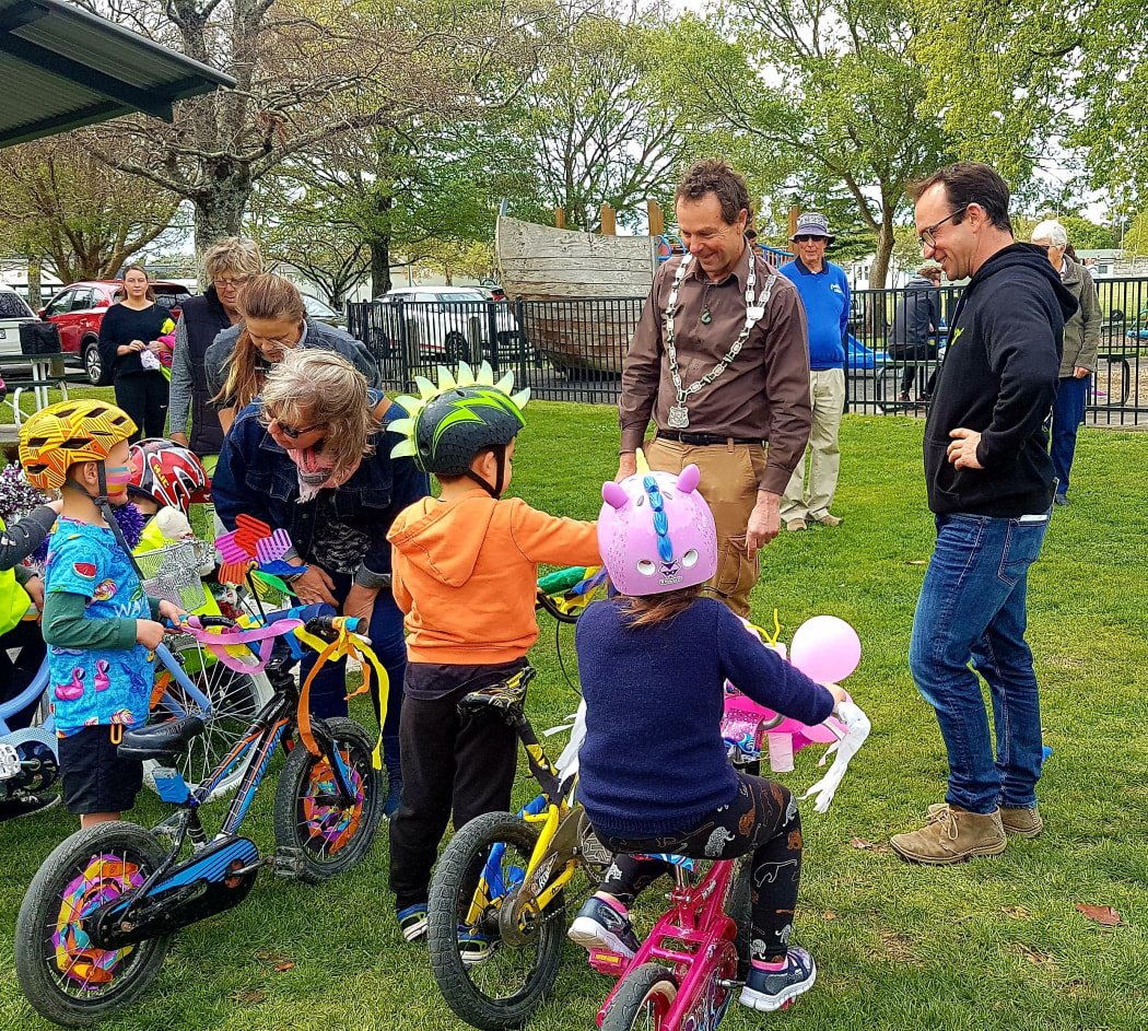 Carterton Mayor Greg Lang with residents in the town's Carrington Park. The council is seeking feedback on two "significant" plans.
