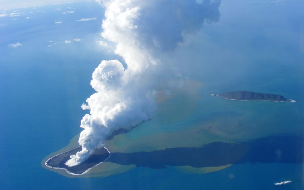 This picture taken on 19 March 2009 shows an aerial photo of ash rising into the air from an undersea volcanic eruption, part of the uninbabited islet of Hunga Ha'apai, 63 kilometres northwest of the Tongan capital Nuku'alofa.