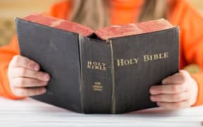 Girl holding bible