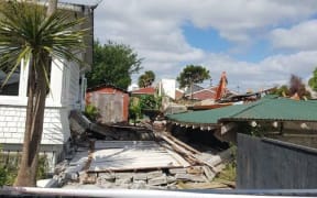 A chimney crashed through the Patersons' bedroom while they were eating dinner.