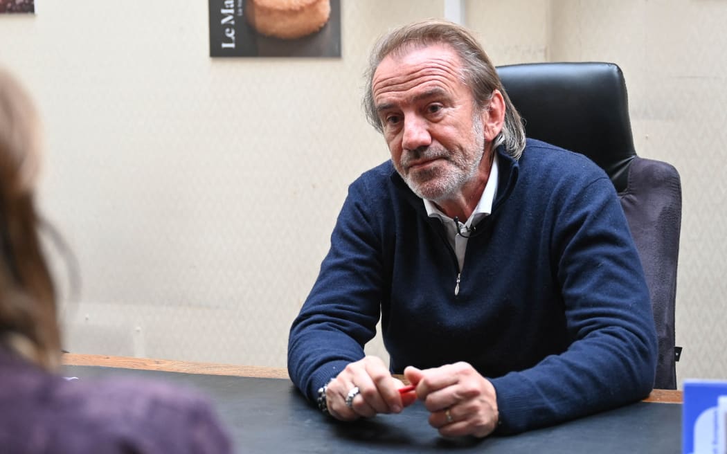 Jean-Alexandre Trogneux speaks to the press a day after his son Jean-Baptiste Trogneux, also great-nephew of French First Lady Brigitte Macron, was attacked by anti-government protesters, in Amiens on May 16, 2023. The great-nephew of French First Lady Brigitte Macron, who runs the family's main chocolate shop, has been beaten up in an apparent politically motivated assault, police and family sources said on Tuesday. Local police said they had arrested eight people after the attack, which took place shortly after President Macron had appeared for an interview on the country's main TV news programme at 8:00 pm (1800 GMT) on Monday evening. (Photo by DENIS CHARLET / AFP)