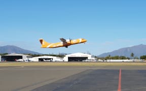 Air Caledonie ATR takes off from Magenta airport in Noumea