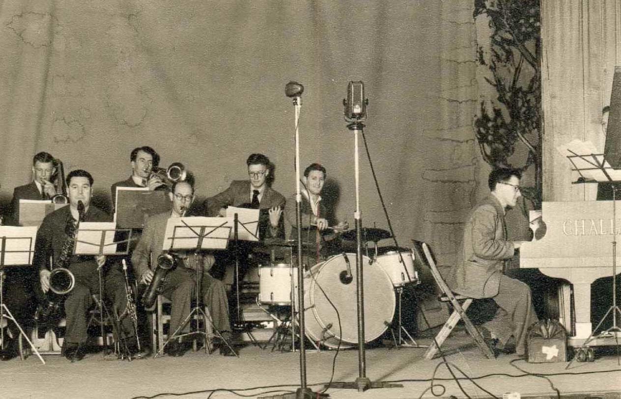 Doug Kelly's Radio Band playing at Christchurch's first Jazz Concert in 1951. Doug Kelly on the far left on trumpet. Gerald Marston is first on the left in back row. Doug Caldwell at the piano.