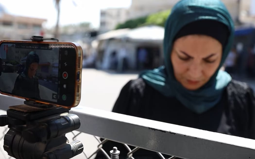 Nour Swiriki has had to document the killings of fellow Gazan journalists. (ABC News)