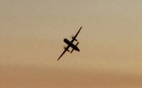 This frame grab taken from footage filmed by bystander John Wauldron of the hijacked plane.