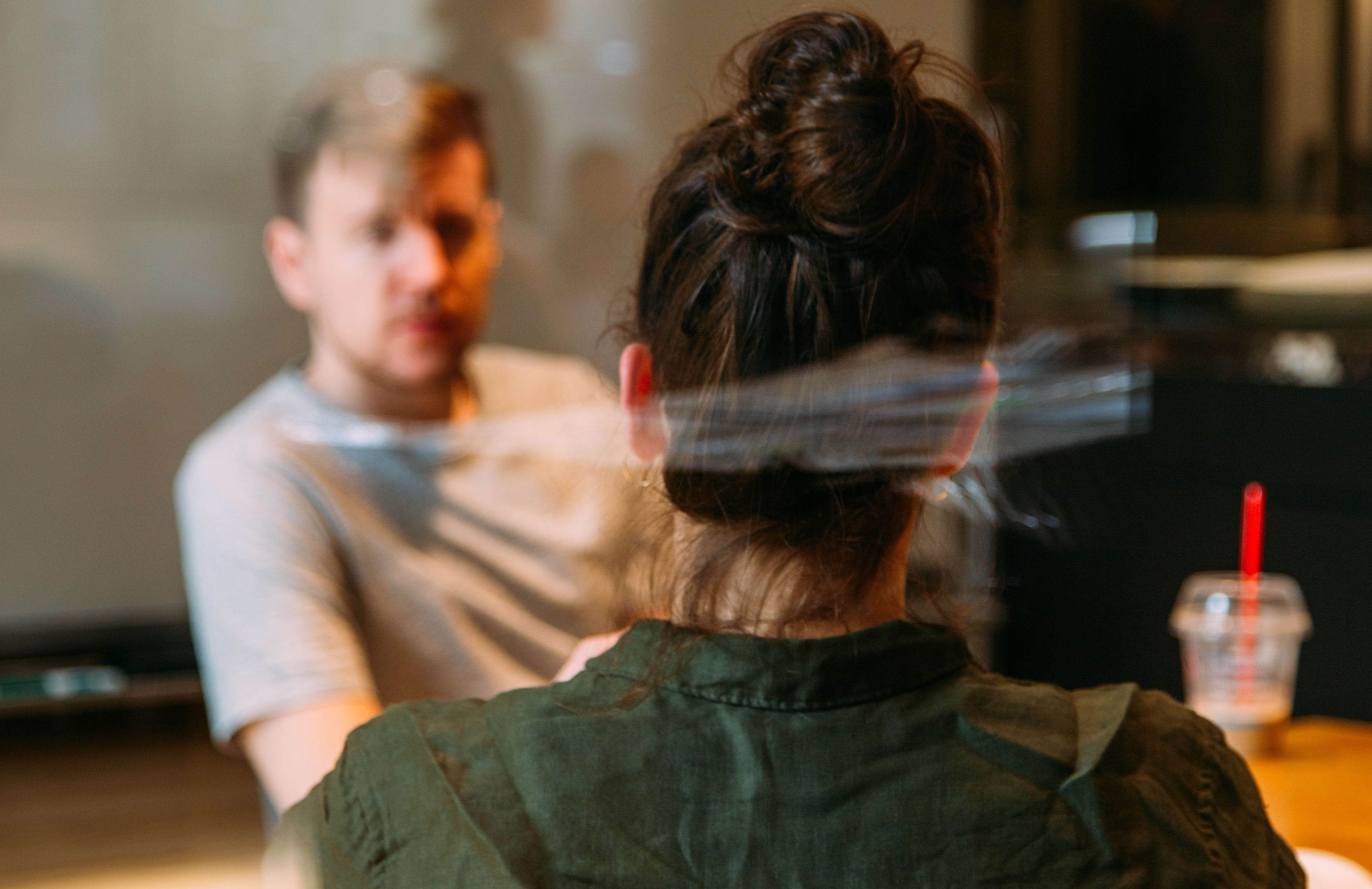 woman and man talking at work